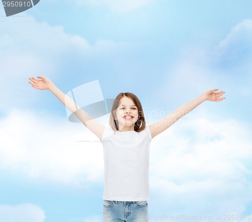 Image of smiling little girl in white blank t-shirt