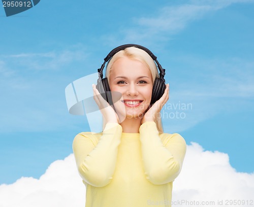 Image of smiling young woman with headphones