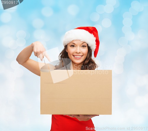 Image of smiling woman in santa helper hat with parcel box