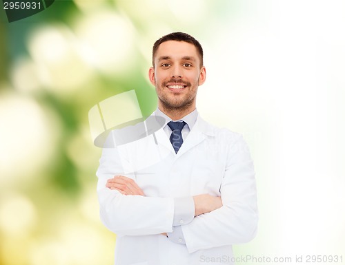 Image of smiling male doctor in white coat