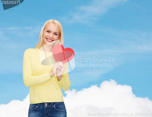 Image of smiling woman with red heart