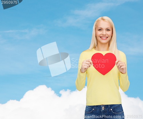 Image of smiling woman with red heart