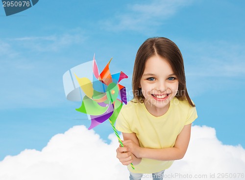 Image of smiling child with colorful windmill toy