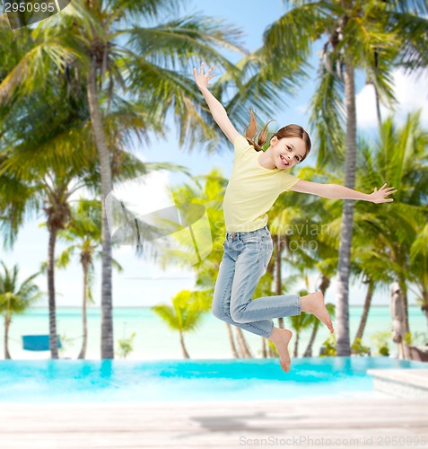 Image of smiling little girl jumping