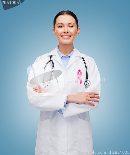 Image of doctor with stethoscope, cancer awareness ribbon