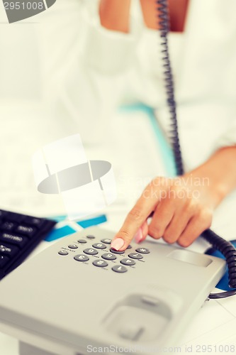 Image of businesswoman with phone calling