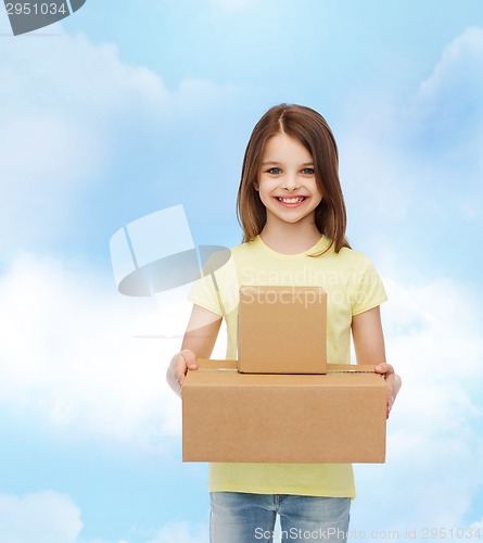 Image of smiling little girl in white blank t-shirt