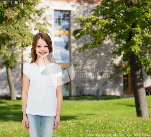 Image of smiling little girl in white blank t-shirt