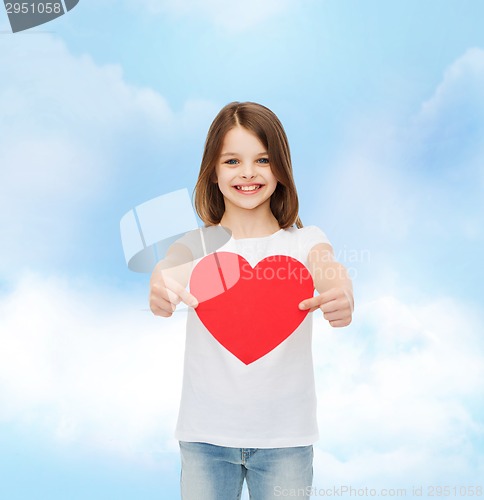 Image of beautiful little girl sitting at table