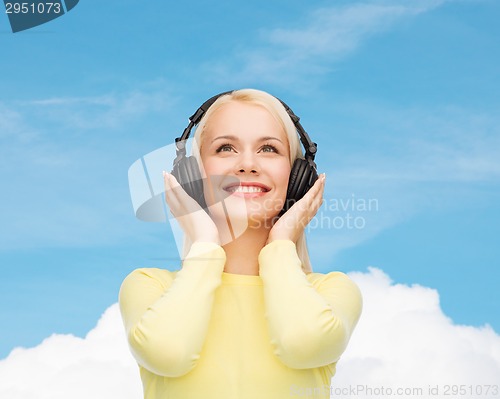 Image of smiling young woman with headphones