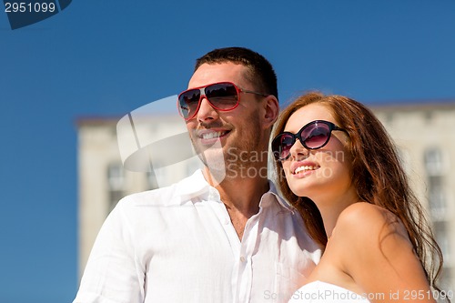 Image of smiling couple in city