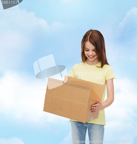 Image of smiling little girl in white blank t-shirt