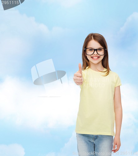 Image of smiling cute little girl in black eyeglasses