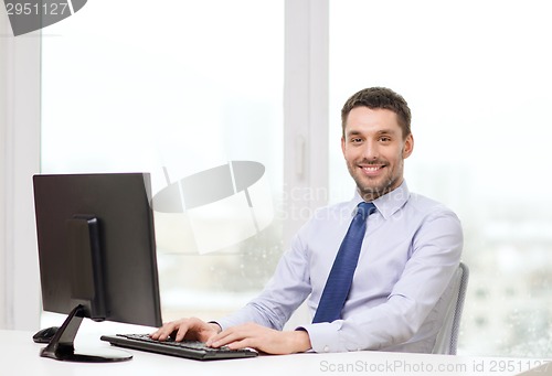 Image of smiling businessman or student with computer