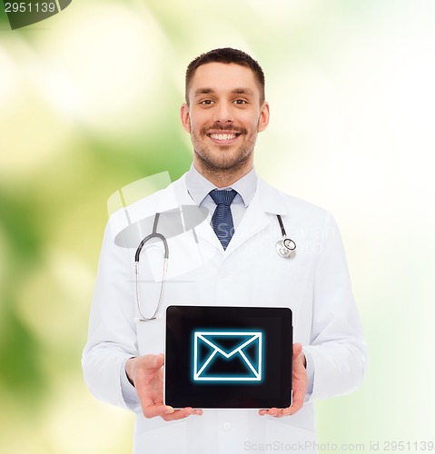 Image of smiling male doctor with tablet pc