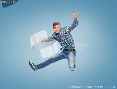 Image of smiling young man jumping in air