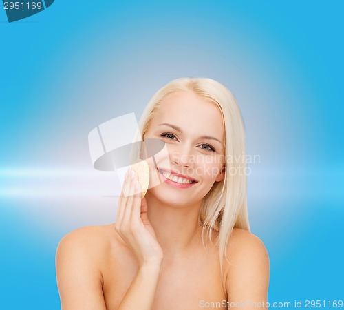 Image of beautiful woman with sponge