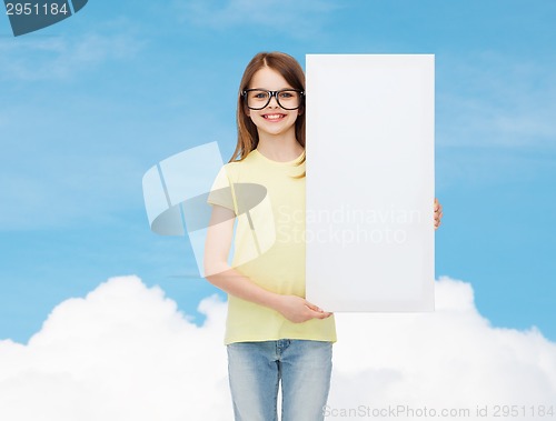 Image of little girl wearing eyeglasses with blank board