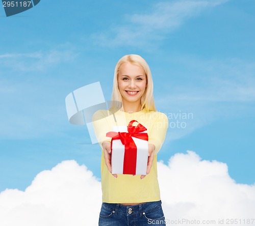 Image of smiling girl with gift box