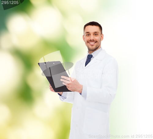 Image of smiling male doctor with clipboard