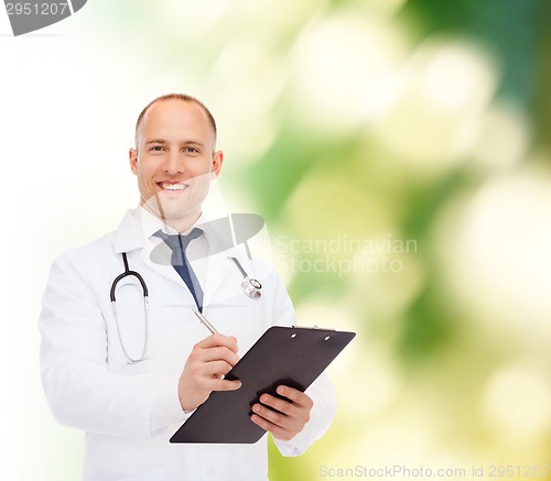 Image of smiling male doctor with clipboard and stethoscope