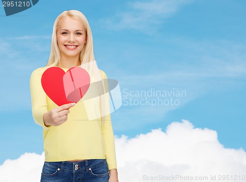 Image of smiling woman with red heart