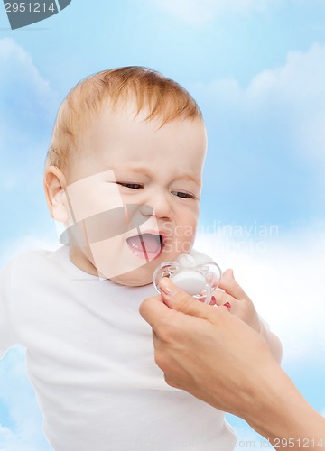 Image of crying baby with dummy