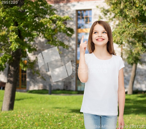 Image of smiling little girl in white blank t-shirt