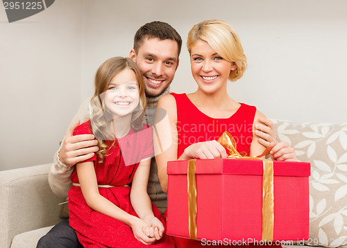 Image of happy family opening gift box