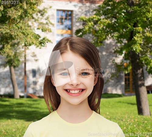 Image of smiling little girl over white background