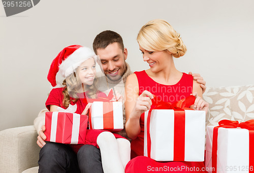Image of happy family opening gift boxes