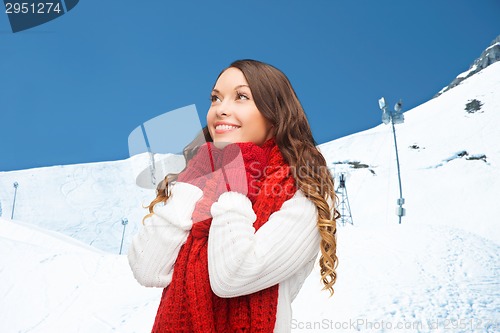 Image of smiling young woman in winter clothes