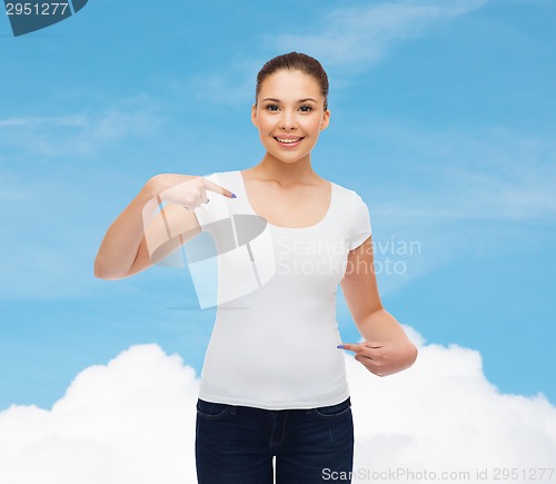 Image of smiling young woman in blank white t-shirt