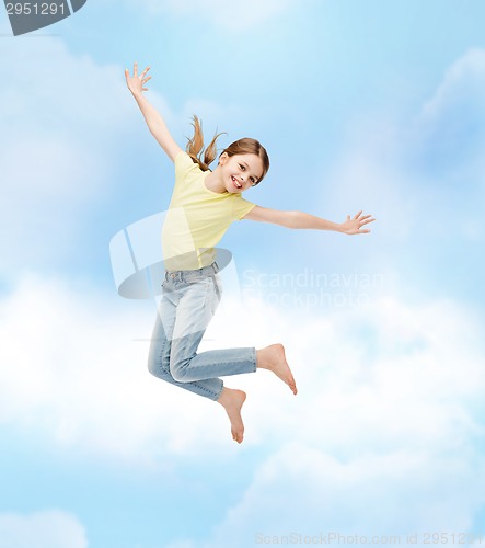 Image of smiling little girl jumping