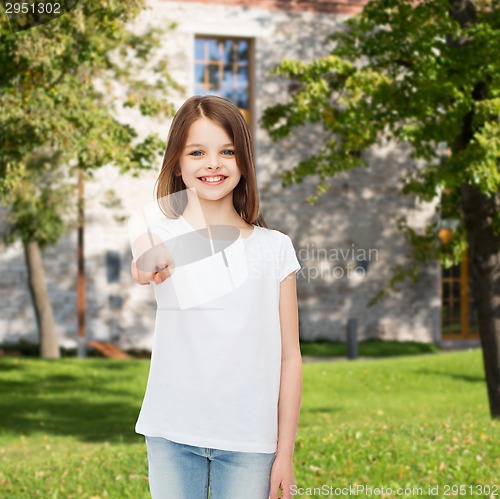 Image of smiling little girl in white blank t-shirt