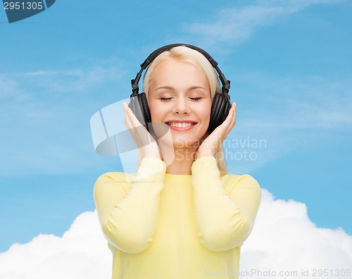 Image of smiling young woman with headphones