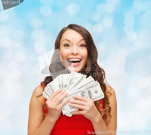 Image of woman in red dress with us dollar money