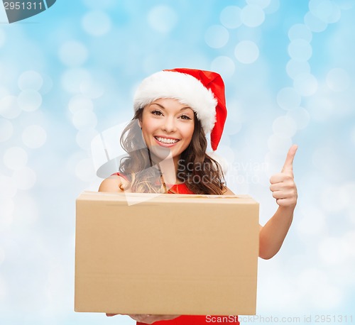 Image of smiling woman in santa helper hat with parcel box