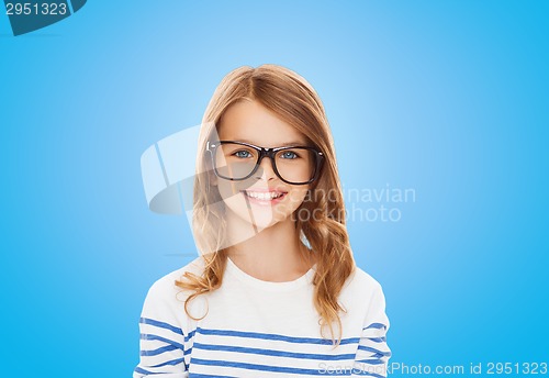 Image of smiling cute little girl with black eyeglasses