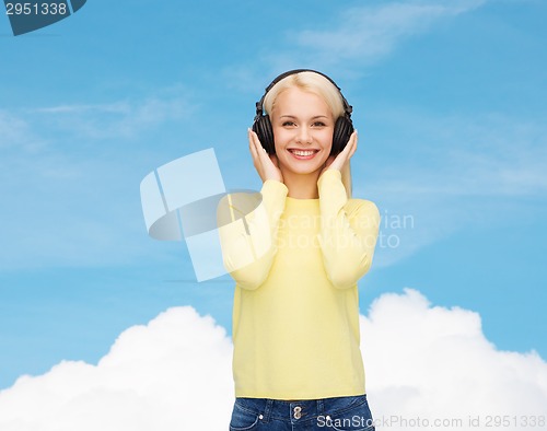 Image of smiling young woman with headphones