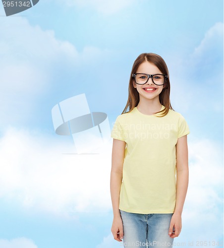 Image of smiling cute little girl in black eyeglasses