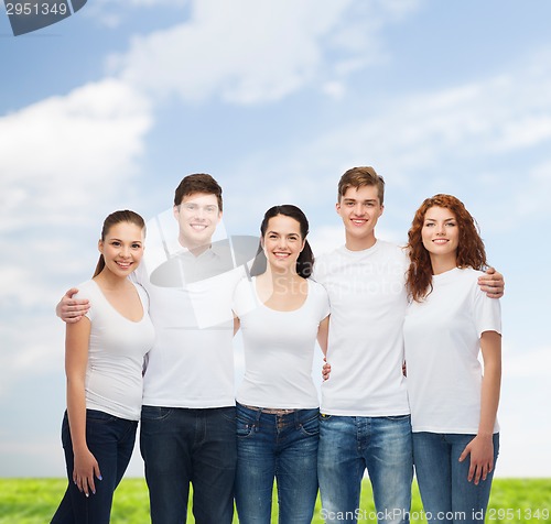 Image of group of smiling teenagers in white blank t-shirts