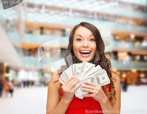 Image of woman in red dress with us dollar money