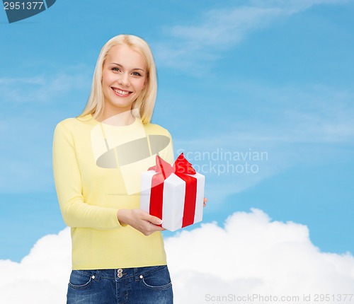 Image of smiling girl with gift box