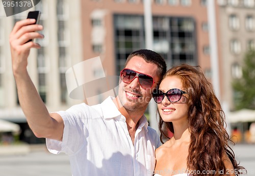 Image of smiling couple in city