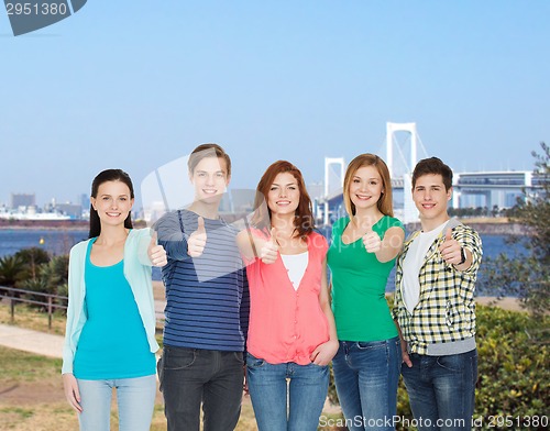 Image of group of smiling students showing thumbs up
