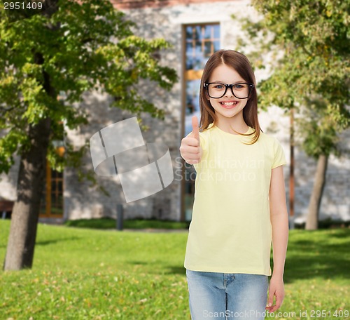 Image of smiling cute little girl in black eyeglasses