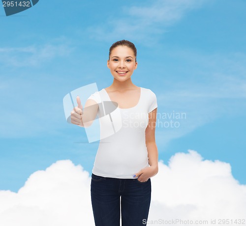Image of smiling young woman in blank white t-shirt