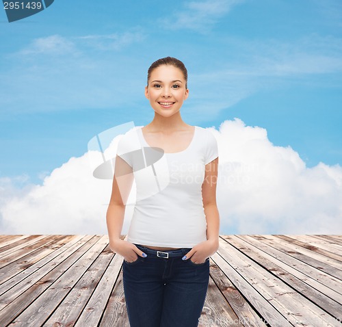 Image of smiling young woman in blank white t-shirt