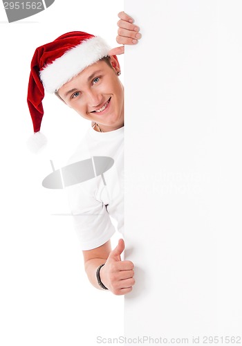 Image of Young man in Santa hat